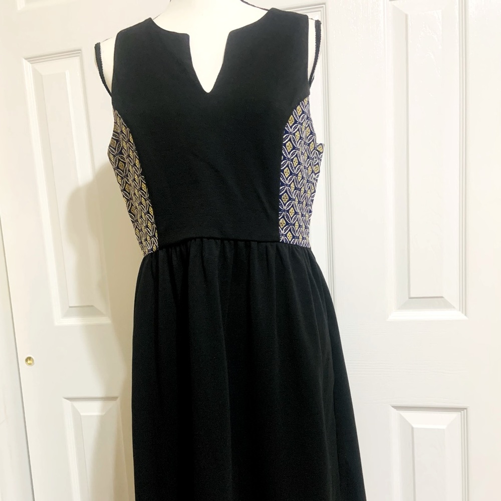 Black dress, side embroidery with blue and gold.